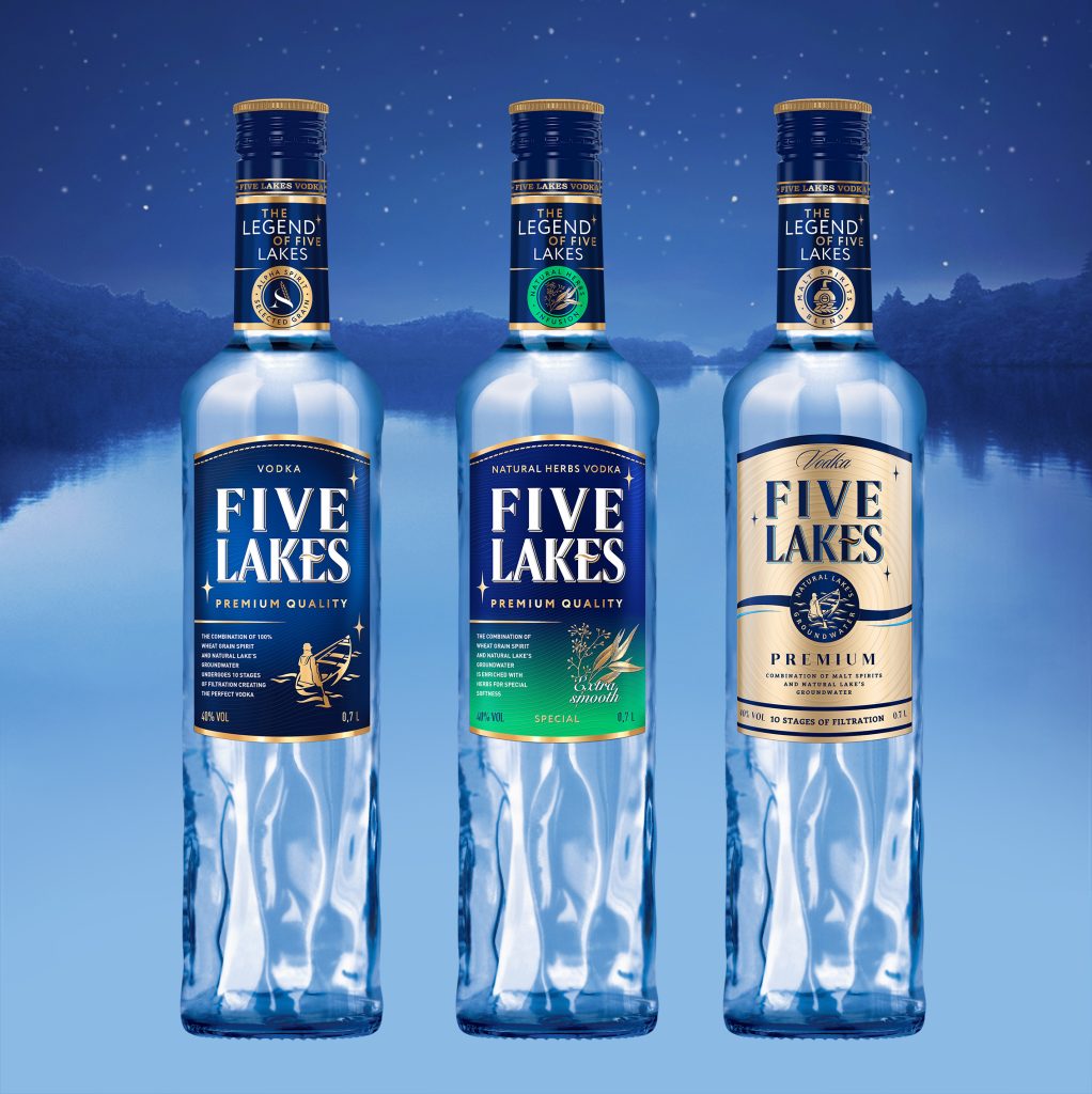 Five Lakes Classic, Special and Premium vodka bottles in front of a lake at night